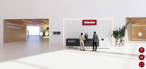 Modernes Foyer der Miele Academy mit Empfangstresen, zwei Besuchern im Gespräch mit einer Mitarbeiterin und seitlichen Eingängen zum eLearning-Bereich.