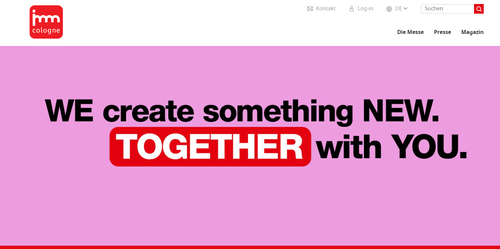 Werbebanner der imm cologne mit dem Slogan „WE create something NEW. TOGETHER with YOU.“ auf pinkem Hintergrund
